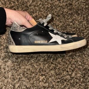 Women’s size 38 Golden Goose black and silver sneakers